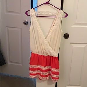 Cream and orange romper.